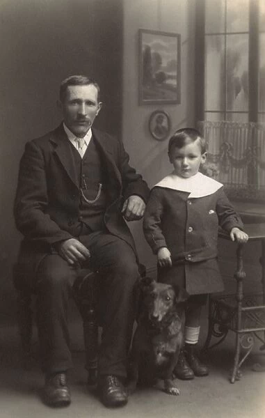 Father and son with dog