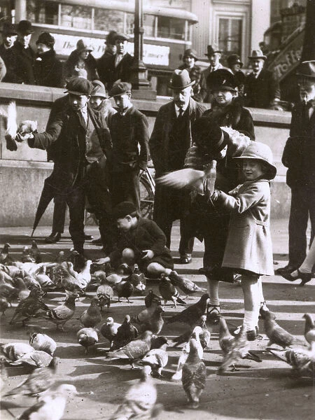 Feeding the pigeons, Trafalgar Square, London