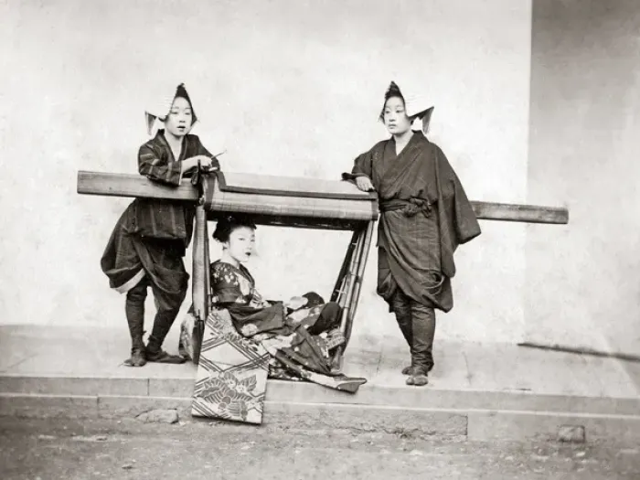 Framed Print : Female bearers and a carrying chair, Japan, 1870s Framed Print : Female bearers and a carrying chair, Japan, 1870s