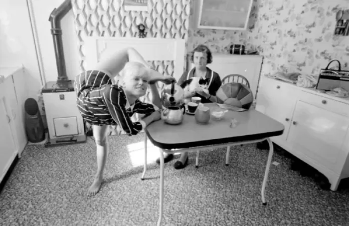 Framed Print : Female contortionist Diana Gaye making tea Framed Print : Female contortionist Diana Gaye making tea