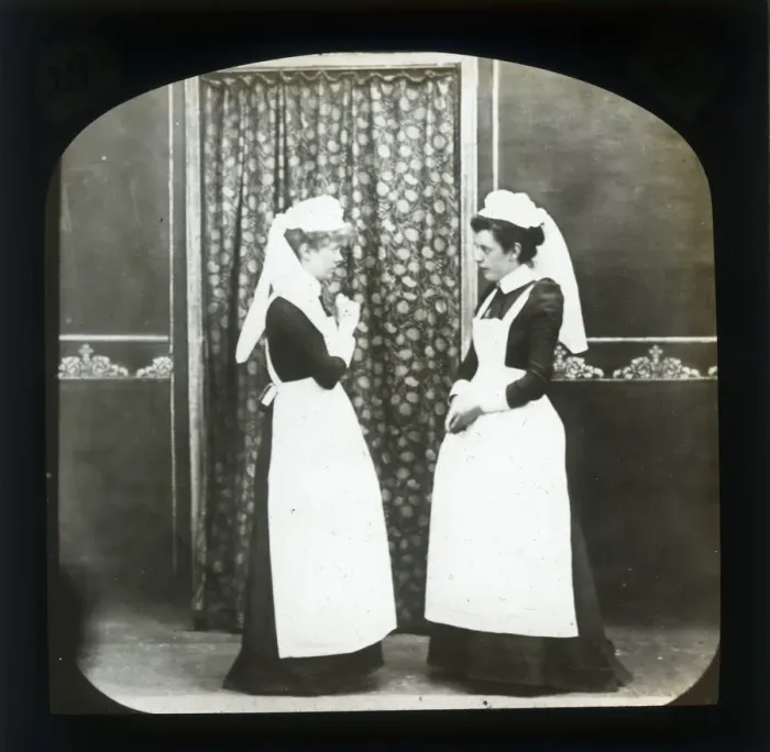 Framed Print : Two female domestic servants in discussion Framed Print : Two female domestic servants in discussion