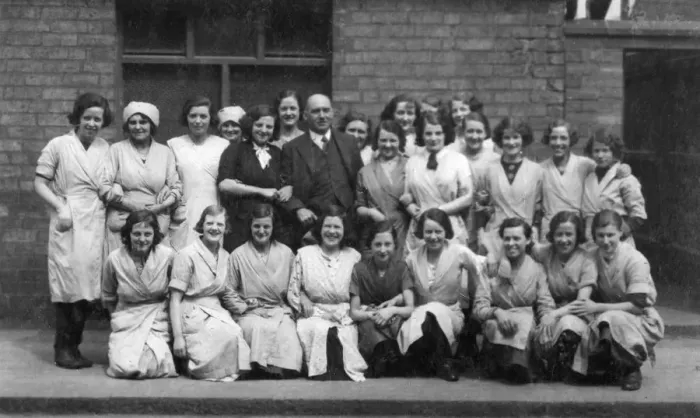 Framed Print : Female factory workers and their male boss