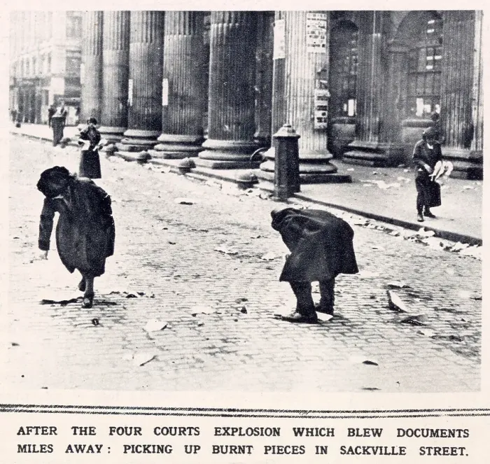 Framed Print : Fighting in Dublin. After the Four Courts explosion which blew documents miles away, burnt pieces are picked up in Sackville Street. Date: 1922 Framed Print : Fighting in Dublin. After the Four Courts explosion which blew documents miles away, burnt pieces are picked up in Sackville Street. Date: 1922