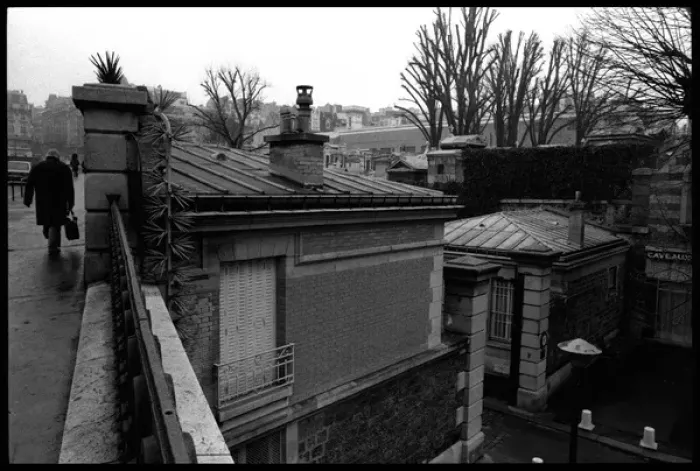 Framed Print : Figure walking outside Paris cemetery, France Framed Print : Figure walking outside Paris cemetery, France