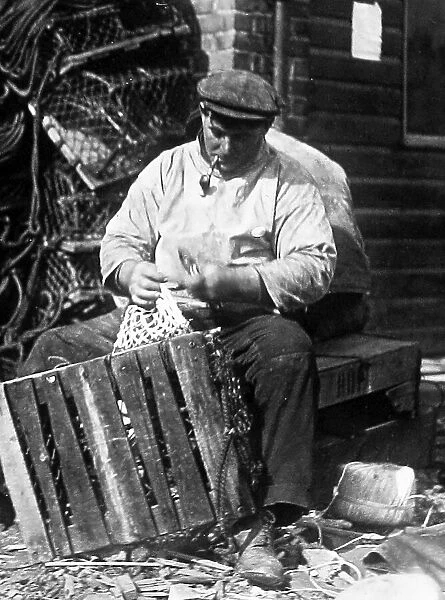 Filey Fisherman making nets early 1900s