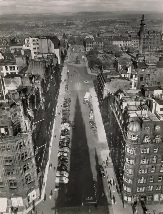Framed Print : A fine overview of St. David's Street, Edinburgh, Scotland, taken from the Sir Walter Scott Monument, with its giant shadow cast up the length of this impressive street. Date: 1950s Framed Print : A fine overview of St. David's Street, Edinburgh, Scotland, taken from the Sir Walter Scott Monument, with its giant shadow cast up the length of this impressive street. Date: 1950s