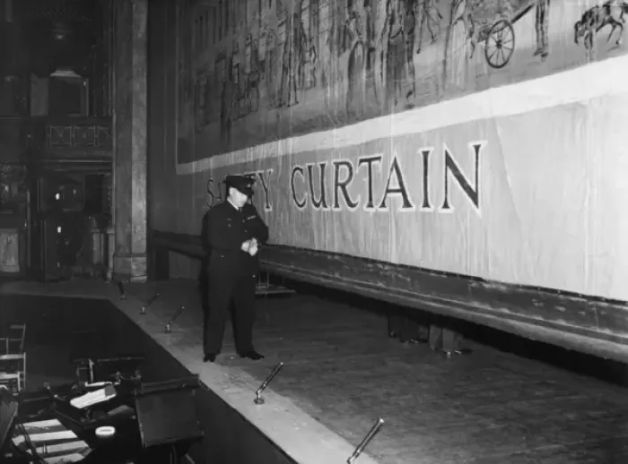 Framed Print : Fire prevention officer checking safety curtain Framed Print : Fire prevention officer checking safety curtain