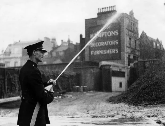 Framed Print : Firefighter in Orange Street, London W1, WW2 Framed Print : Firefighter in Orange Street, London W1, WW2