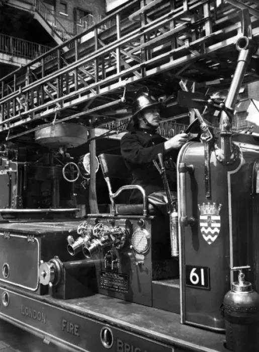 Framed Print : Firefighter at the wheel of a fire engine Framed Print : Firefighter at the wheel of a fire engine