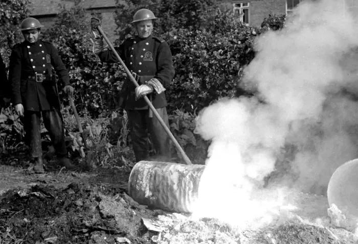 Framed Print : Firefighters deal with small fire caused by explosion, WW2 Framed Print : Firefighters deal with small fire caused by explosion, WW2