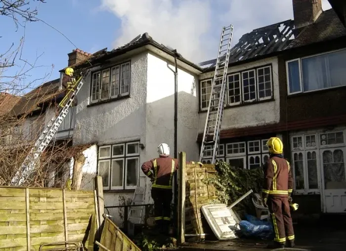Framed Print : Firefighters dealing with a house fire Framed Print : Firefighters dealing with a house fire