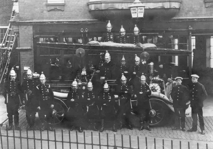 Framed Print : Firefighters and fire engine posing outside station Framed Print : Firefighters and fire engine posing outside station