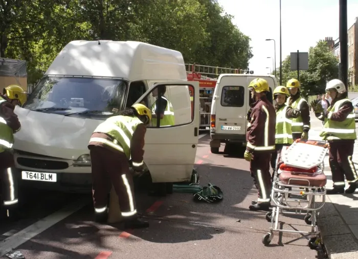 Framed Print : Firefighters inspecting a broken down Ford transit van Framed Print : Firefighters inspecting a broken down Ford transit van