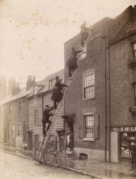 Framed Print : Firefighters and policemen climbing a ladder Framed Print : Firefighters and policemen climbing a ladder