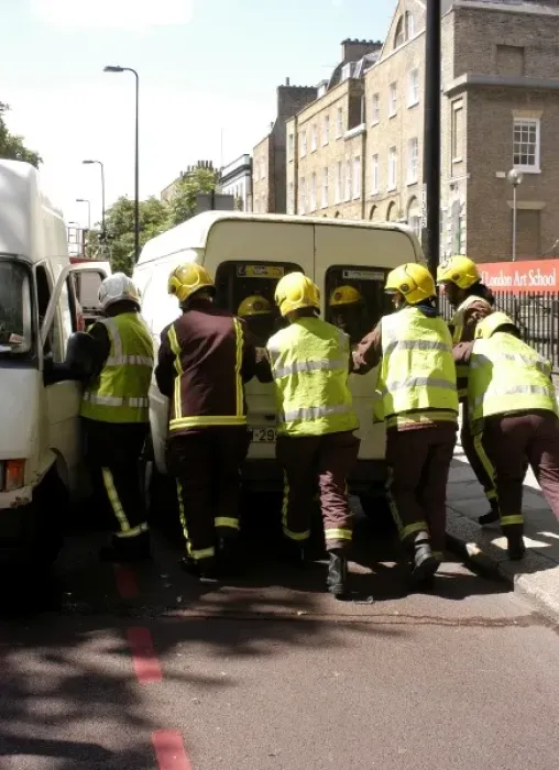 Framed Print : Firefighters pushing a broken down Ford transit van Framed Print : Firefighters pushing a broken down Ford transit van