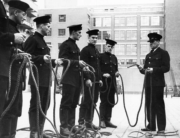 Firefighters receiving knots instruction