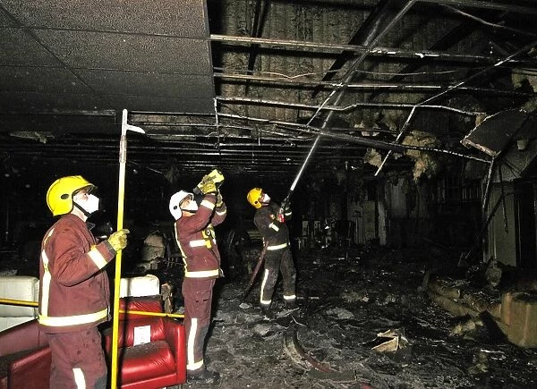 Firefighters at the scene of a fire in a furniture shop