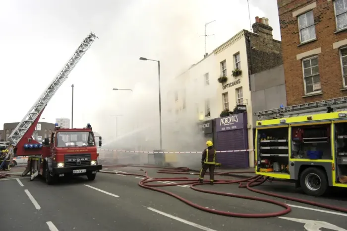 Framed Print : Firefighters at scene of fire, Stockwell Road, Brixton Framed Print : Firefighters at scene of fire, Stockwell Road, Brixton