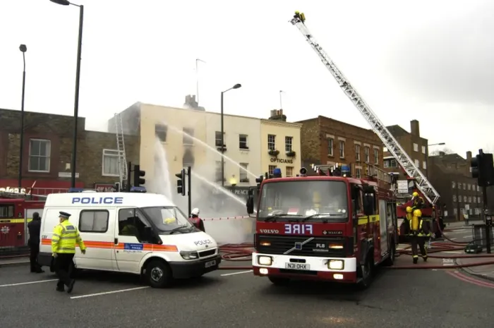 Framed Print : Firefighters at scene of fire, Stockwell Road, Brixton Framed Print : Firefighters at scene of fire, Stockwell Road, Brixton