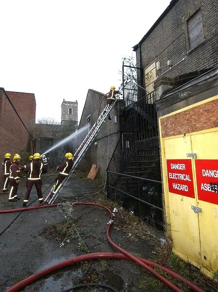 Firefighters at the scene of a warehouse fire, SE London