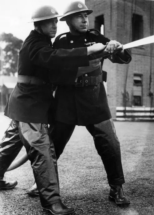 Framed Print : Firefighters taking part in a hose training drill, WW2 Framed Print : Firefighters taking part in a hose training drill, WW2