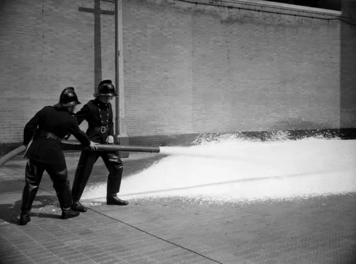 Framed Print : Firefighters training with foam extinguisher Framed Print : Firefighters training with foam extinguisher
