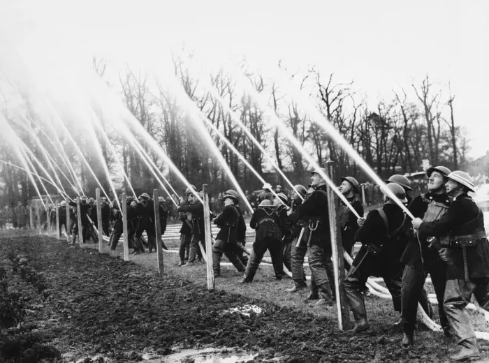 Framed Print : Firemen at hose drill during World War II Date: 1941 Framed Print : Firemen at hose drill during World War II Date: 1941