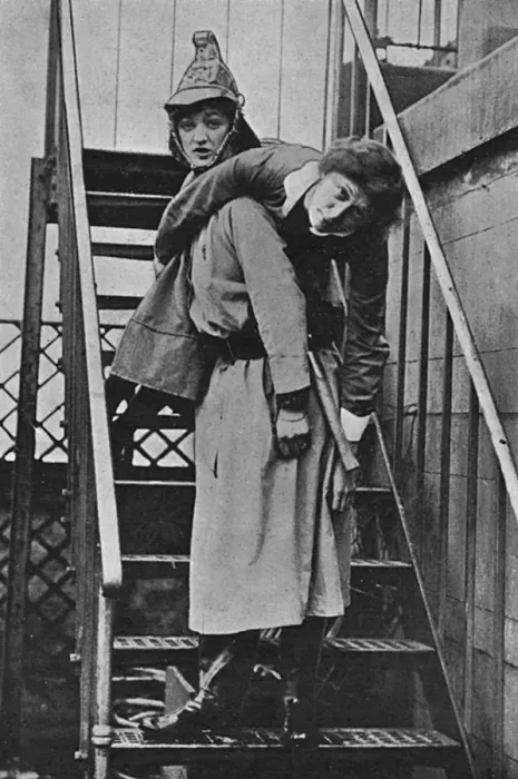 Framed Print : Firewomen, a rescue on an iron staircase, WW1 Framed Print : Firewomen, a rescue on an iron staircase, WW1