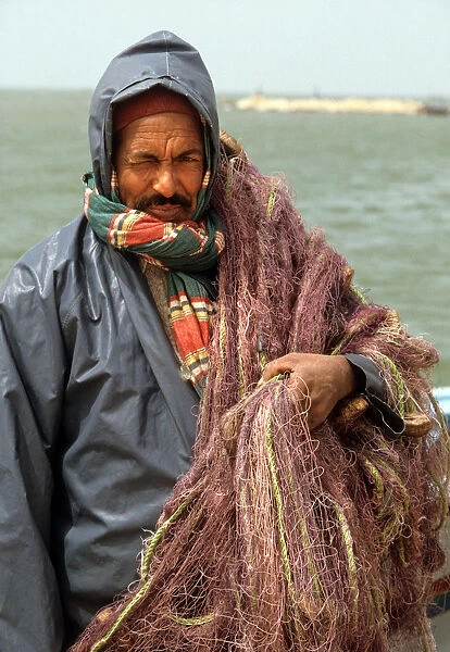 A fisherman wearing oilskins. Djerba, Tunisia