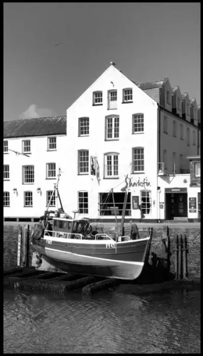 Framed Print : Fishing boat lifted Mevagissey harbour, Cornwall