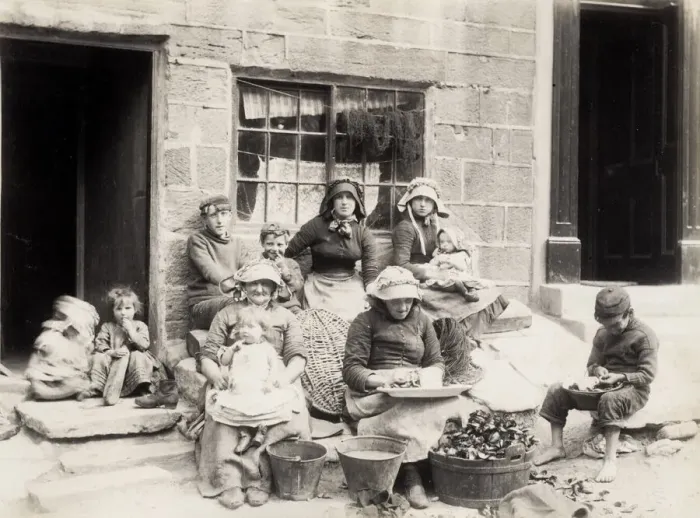 Framed Print : Fishing family outside their home in Staithes Yorkshire Framed Print : Fishing family outside their home in Staithes Yorkshire