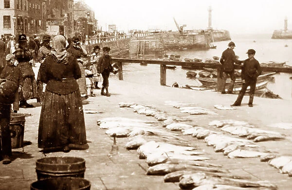 A fishwife selling fish on the quayside, Victorian period