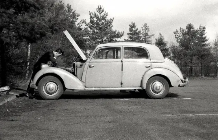 Framed Print : Fixing a car Framed Print : Fixing a car