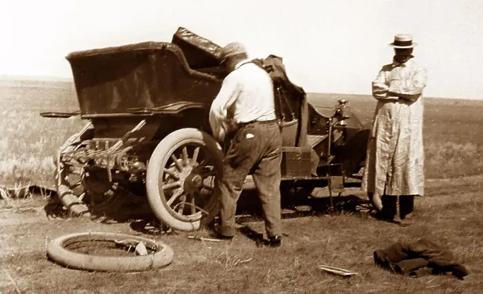 Framed Print : Fixing a puncture, early 1900s Framed Print : Fixing a puncture, early 1900s