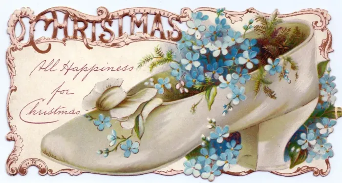 Framed Print : Flowers growing in a shoe on a Christmas card Framed Print : Flowers growing in a shoe on a Christmas card