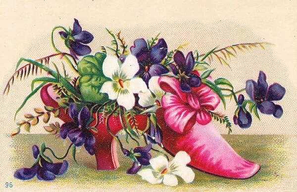 Flowers growing in a shoe on a greetings card