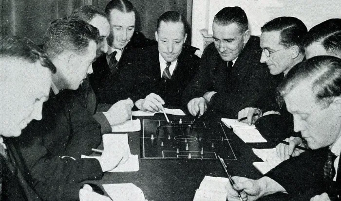 Framed Print : Football referees studying the rules of the game Framed Print : Football referees studying the rules of the game