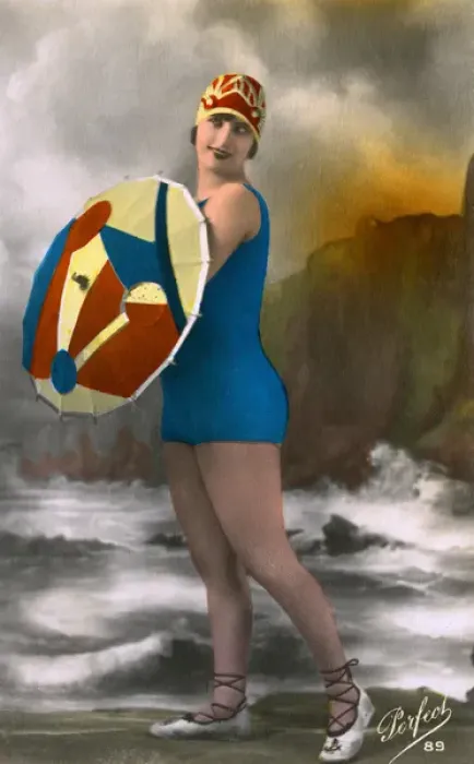 Framed Print : French girl in swimwear, carrying a colouful parasol Framed Print : French girl in swimwear, carrying a colouful parasol