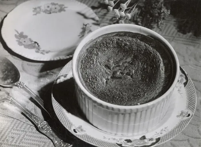 Framed Print : A freshly made chocolate souffle, temptingly and decoratively arranged on a table and ready to be eaten Date: 1930s Framed Print : A freshly made chocolate souffle, temptingly and decoratively arranged on a table and ready to be eaten Date: 1930s