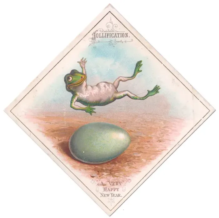 Framed Print : Frog and egg on a New Year card Framed Print : Frog and egg on a New Year card