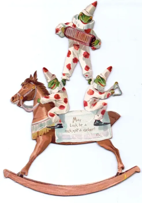 Framed Print : Three frogs and rocking horse on a cutout card Framed Print : Three frogs and rocking horse on a cutout card