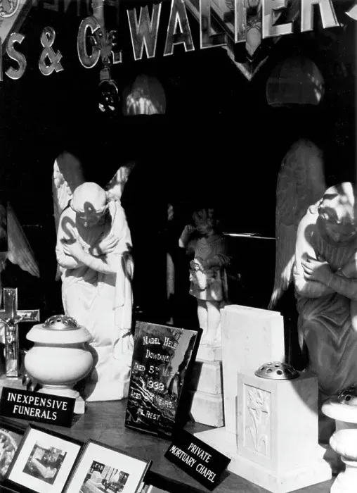 Framed Print : Funerary monuments in display window Framed Print : Funerary monuments in display window