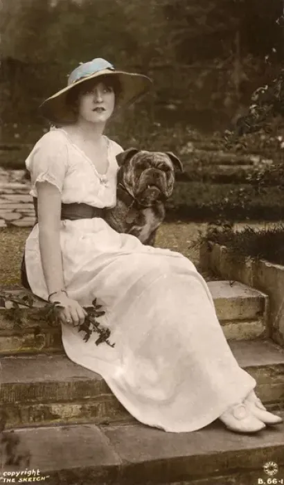 Framed Print : Gabrielle Ray, English actress, with a dog in a garden Framed Print : Gabrielle Ray, English actress, with a dog in a garden