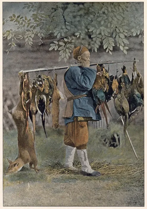 Framed Print : A game vendor in China carries a variety of meat for sale on a long pole Date: circa 1890 Framed Print : A game vendor in China carries a variety of meat for sale on a long pole Date: circa 1890