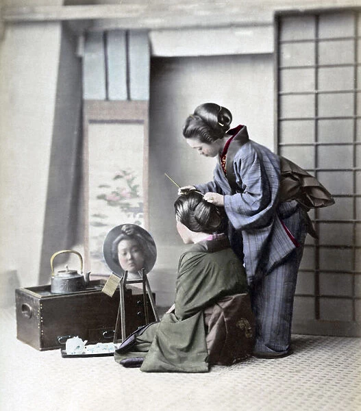 Geishas hairdressing, Japan, circa 1870s. Date: circa 1870s