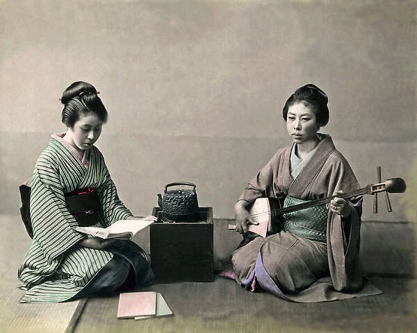 Two geishas, stove and shamisen, Japan