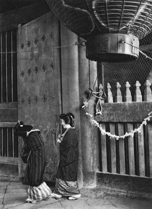 Framed Print : Two Geishas walk outside a temple Framed Print : Two Geishas walk outside a temple