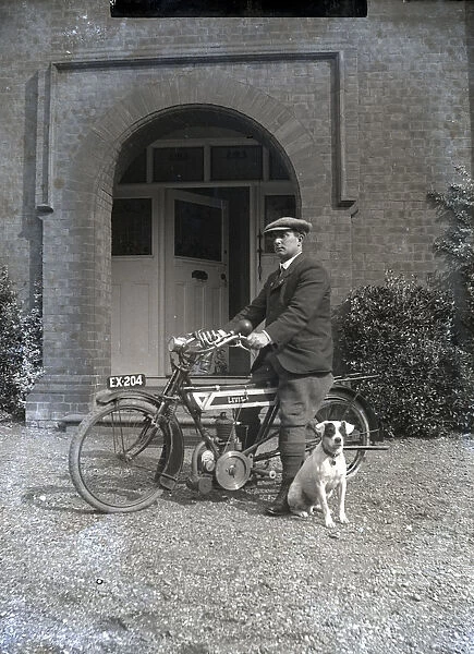 Gentleman with his motorcycle and pet dog