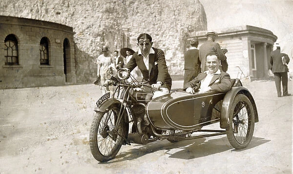 Two gentlemen on a 1928  /  9 Dunelt motorcycle & sidecar