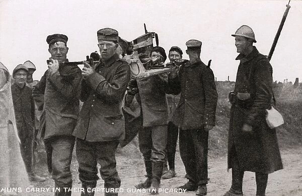 German prisoners made to carry their guns - WWI